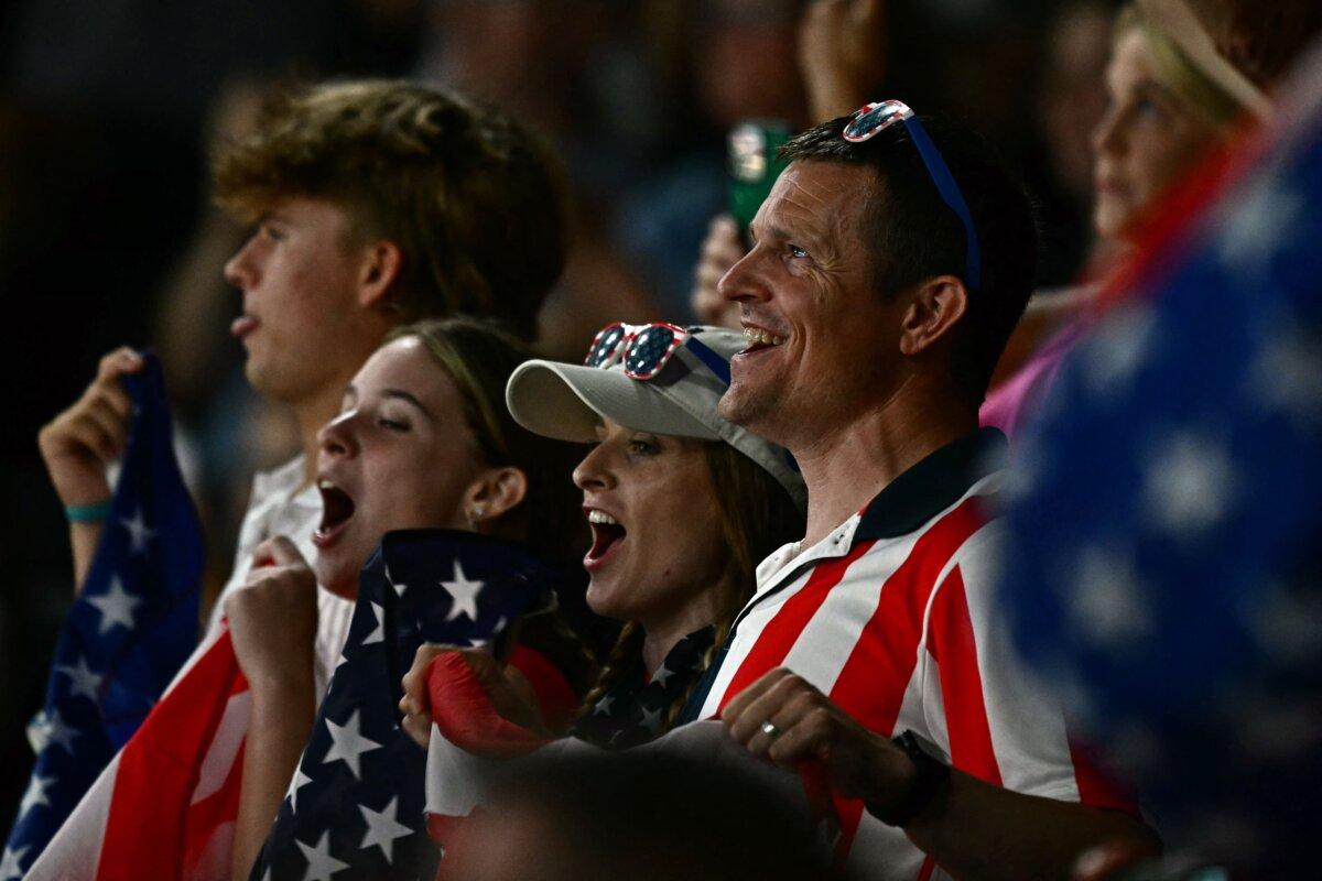 Team USA's supporters cheer their team during the artistic gymnastics women's all around final during the Paris 2024 Olympic Games at the Bercy Arena in Paris, on August 1, 2024. (Gabriel Bouys/AFP via Getty Images)