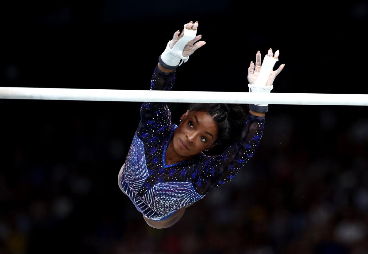 Simone Biles of Team United States competes on the uneven bars during the Artistic Gymnastics Women's All-Around Final on day six of the Olympic Games Paris 2024 at Bercy Arena in Paris on August 1, 2024. (Naomi Baker/Getty Images)