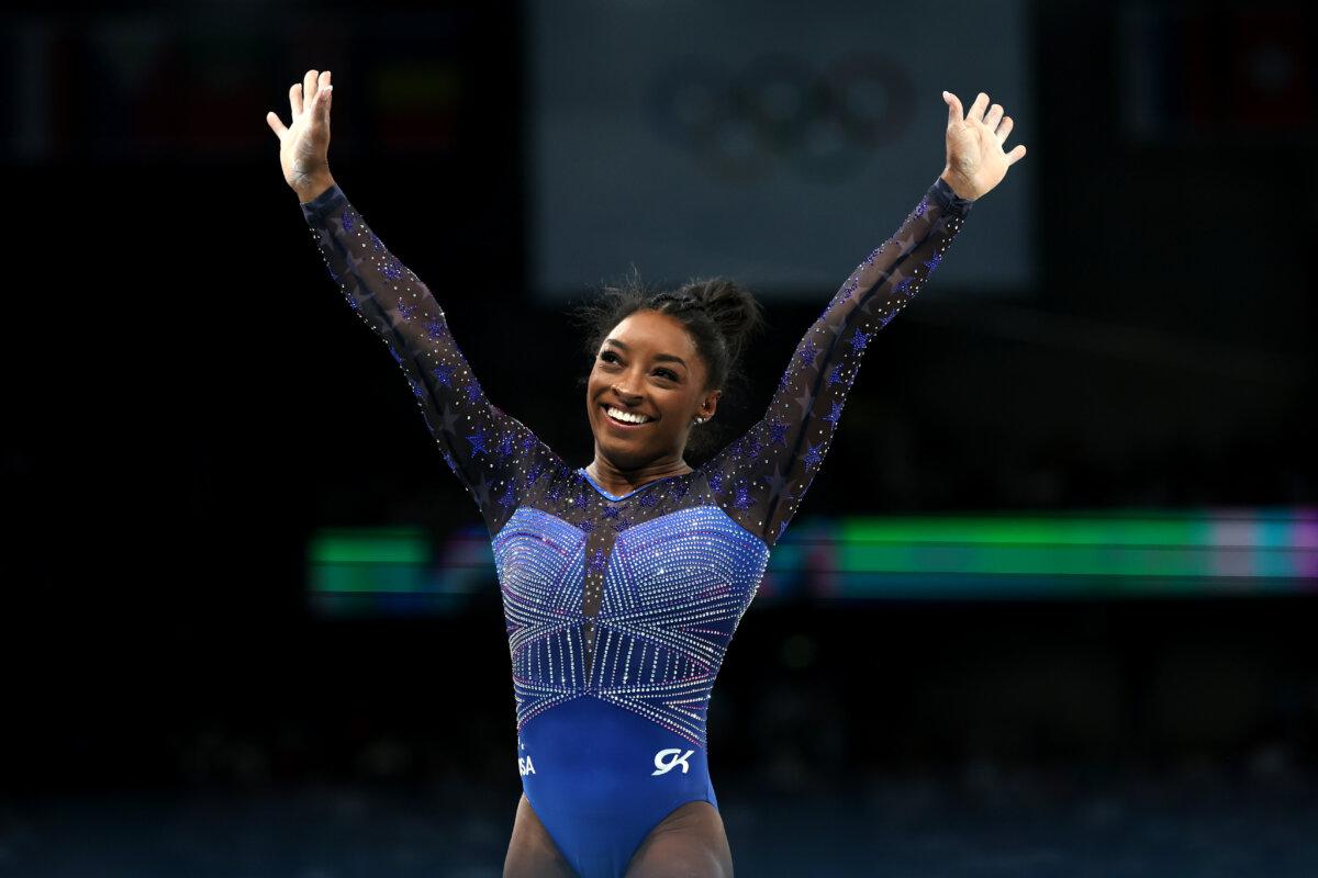 Simone Biles of Team United States reacts after finishing her routine on the balance beam during the Artistic Gymnastics Women's All-Around Final on day six of the Olympic Games Paris 2024 at Bercy Arena in Paris on August 1, 2024. (Ezra Shaw/Getty Images)