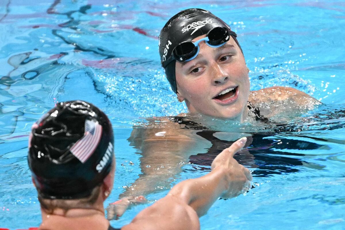 Canada's Summer Mcintosh (R) reacts with second-placed US' Regan Smith after winning the final of the women's 200m butterfly swimming event during the Paris 2024 Olympic Games at the Paris La Defense Arena in Nanterre, west of Paris, on August 1, 2024. (Jonathan Nackstrand/AFP via Getty Images)
