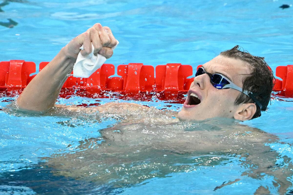 Hungary's Hubert Kos celebrates after winning the final of the men's 200m backstroke swimming event during the Paris 2024 Olympic Games at the Paris La Defense Arena in Nanterre, west of Paris, on August 1, 2024. (Jonathan Nackstraand/AFP via Getty Images)