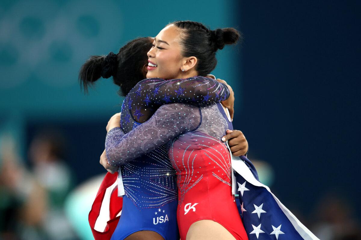 Gold medalist Simone Biles hugs Bronze medalist Suni Lee of Team United States after competing in the Artistic Gymnastics Women's All-Around Final on day six of the Olympic Games Paris 2024 at Bercy Arena in Paris on August 1, 2024. (Pascal Le Segretain/Getty Images)