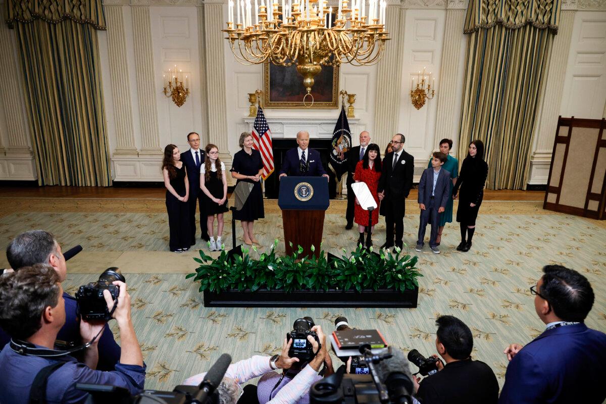 President Joe Biden, joined by relatives of American prisoners freed by Russia, delivers remarks on the release of Wall Street Journal reporter Evan Gershkovich and former U.S. Marine Paul Whelan from Russian captivity, in the State Dining Room at the White House, on Aug. 1, 2024. (Chip Somodevilla/Getty Images)