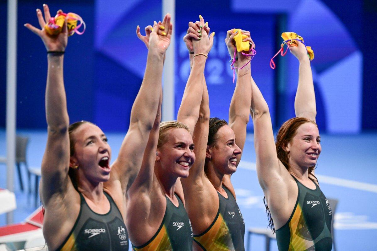 Team Australia Australia's Mollie O'callaghan, Australia's Lani Pallister, Australia's Brianna Throssell and Australia's Ariarne Titmus celebrate after winning the final of the women's 4x200m freestyle relay swimming event during the Paris 2024 Olympic Games at the Paris La Defense Arena in Nanterre, west of Paris, on Aug. 1, 2024. (François-Xavier Marit/AFP via Getty Images)