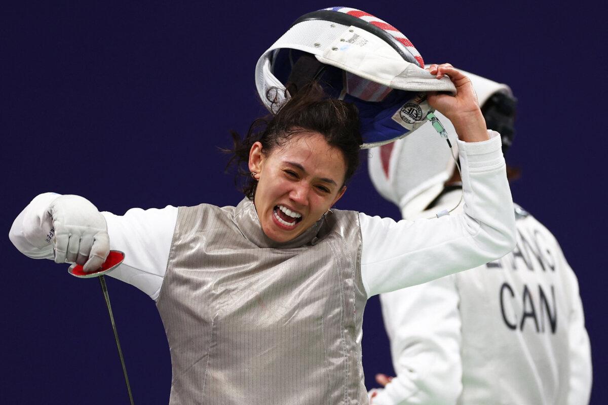 US' Lee Kiefer reacts as she competes against Canada's Yunjia Zhang in the women's foil team semi-final bout between Canada and USA during the Paris 2024 Olympic Games at the Grand Palais in Paris, on August 1, 2024. (Franck Fife/ AFP via Getty Images)