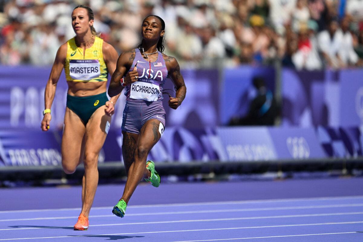 US' Sha'Carri Richardson competes in the women's 100m heat of the athletics event at the Paris 2024 Olympic Games at Stade de France in Saint-Denis, north of Paris, on August 2, 2024. (Andrej Isakovic/AFP via Getty Images)
