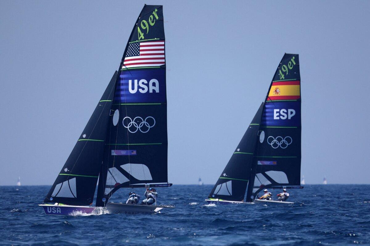 US' duo Ian Barrows and Hans Henken and Spain's duo Diego Botin Le Chever and Florian Trittel Paul compete in the medal race of the men's 49er skiff event during the Paris 2024 Olympic Games sailing competition at the Roucas-Blanc Marina in Marseille on August 2, 2024. (Clement Mahoudeau/AFP via Getty Images)