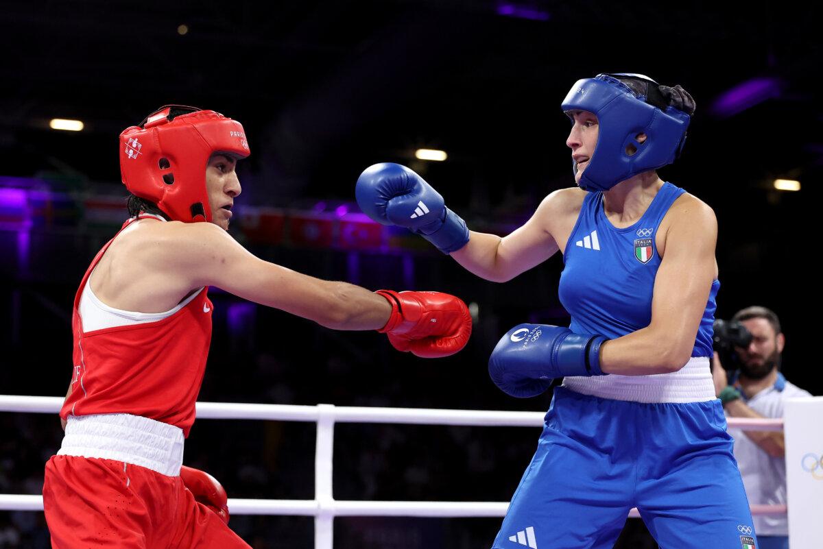 Imane Khelif of Team Algeria and Angela Carini of Team Italy exchange punches during the Women's 66kg preliminary round match on day six of the Olympic Games Paris 2024 at North Paris Arena in Paris on August 1, 2024. (Richard Pelham/Getty Images)