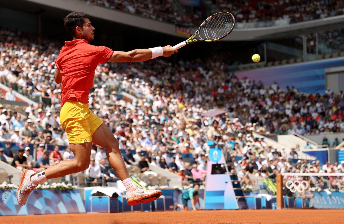 Carlos Alcaraz of Team Spain plays a forehand during the Tennis Men's Singles Semifinal match against Felix Auger-Aliassime of Team Canada on day seven of the Olympic Games Paris 2024 at Roland Garros in Paris on August 2, 2024. (Matthew Stockman/Getty Images)