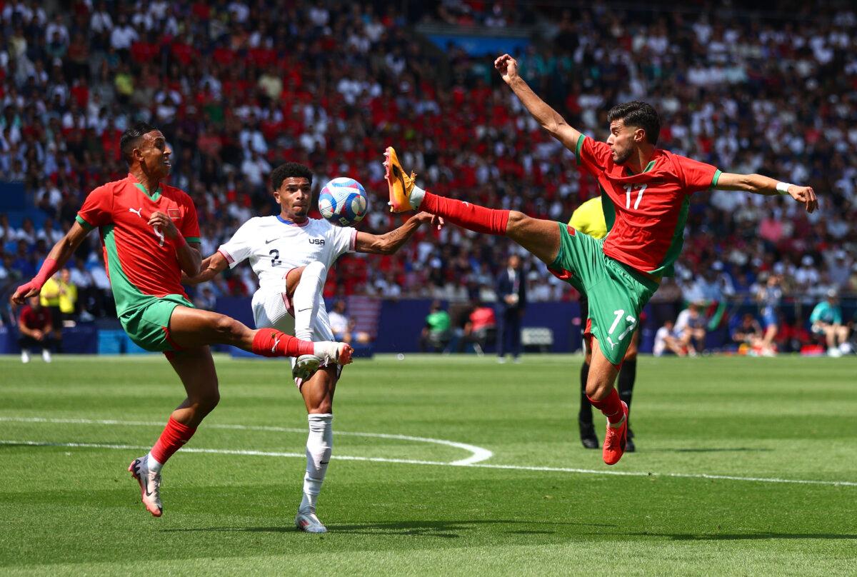 Nathan Harriel #2 of Team United States fouls Soufiane Rahimi #9 of Team Morocco during the Men's Quarter Final match between Morocco and United States during the Olympic Games Paris 2024 at Parc des Princes in Paris on August 2, 2024. (Marc Atkins/Getty Images)