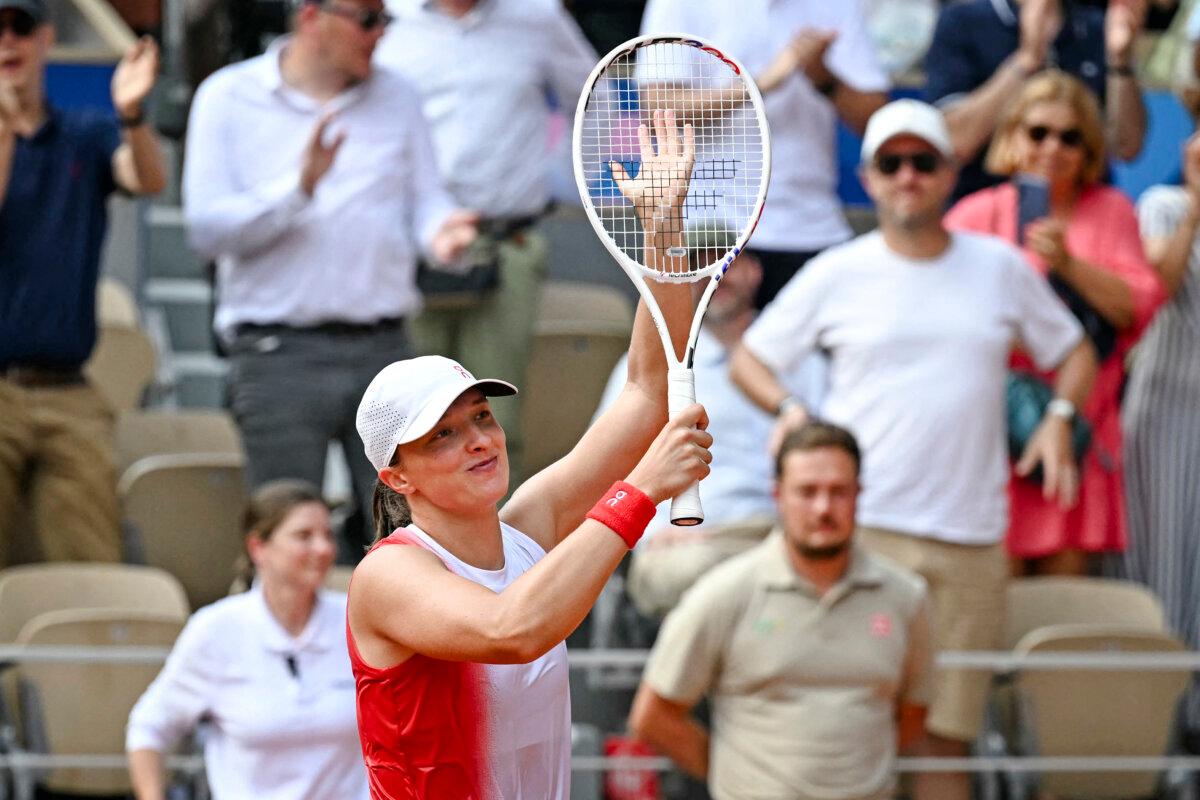 Poland's Iga Swiatek celebrates after beating Slovakia's Anna Karolina Schmiedlova in their women's singles Bronze Medal tennis match on Court Philippe-Chatrier at the Roland-Garros Stadium during the Paris 2024 Olympic Games, in Paris on August 2, 2024. (Miguel Medina/ AFP via Getty Images)