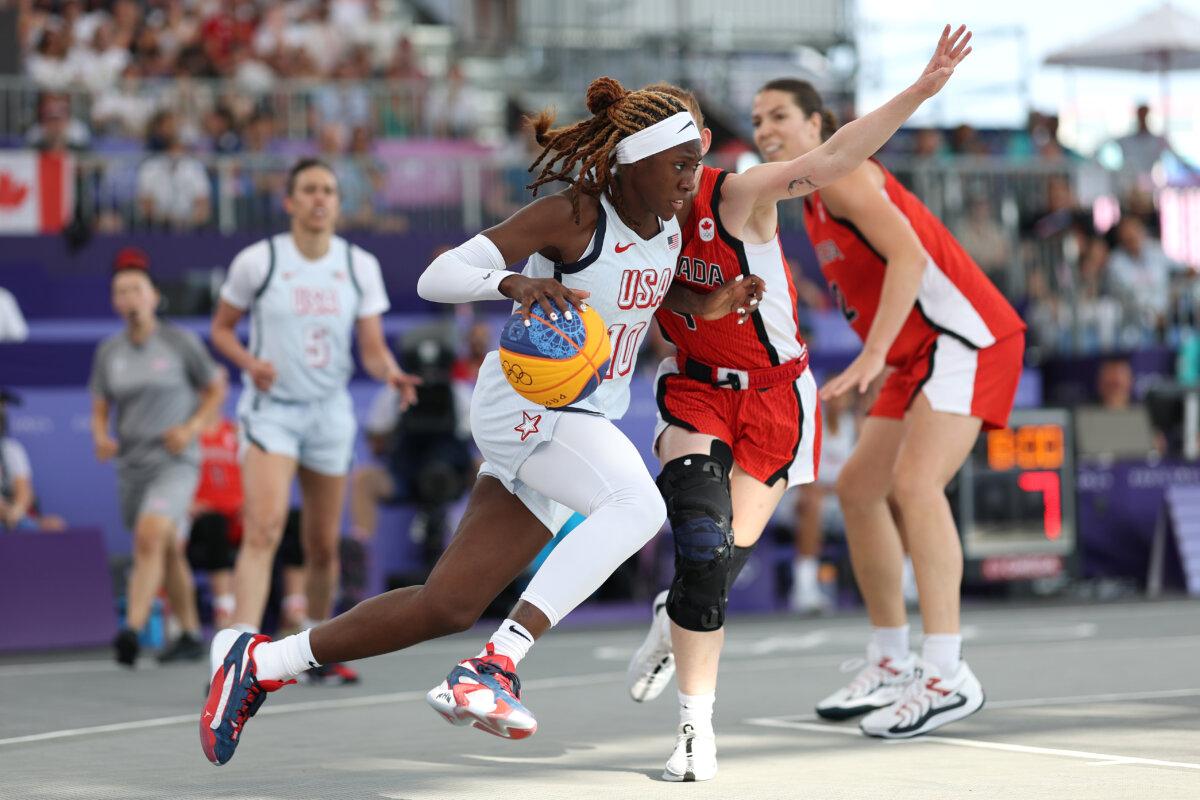 Rhyne Howard #10 of Team United States drives towards the basket during a Women's 3x3 Basketball Pool Round game between the United States and Canada on day seven of the Olympic Games Paris 2024 at Esplanade Des Invalides in Paris on August 2, 2024. (Lintao Zhang/Getty Images)