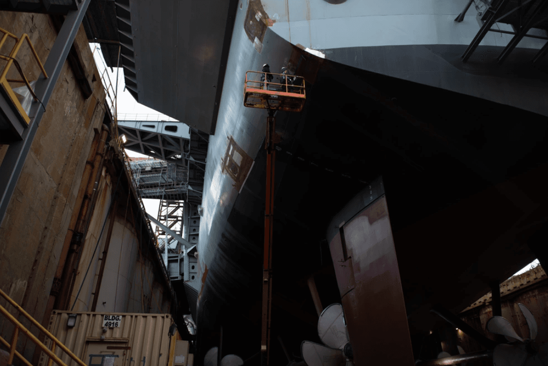 Shipbuilding contractors conduct maintenance on the aircraft carrier USS John C. Stennis (CVN 74), in Newport News, Virginia, on Dec. 13, 2023. (U.S. Navy photo by Mass Communication Specialist 3rd Class Max Biesecker/Public Domain)