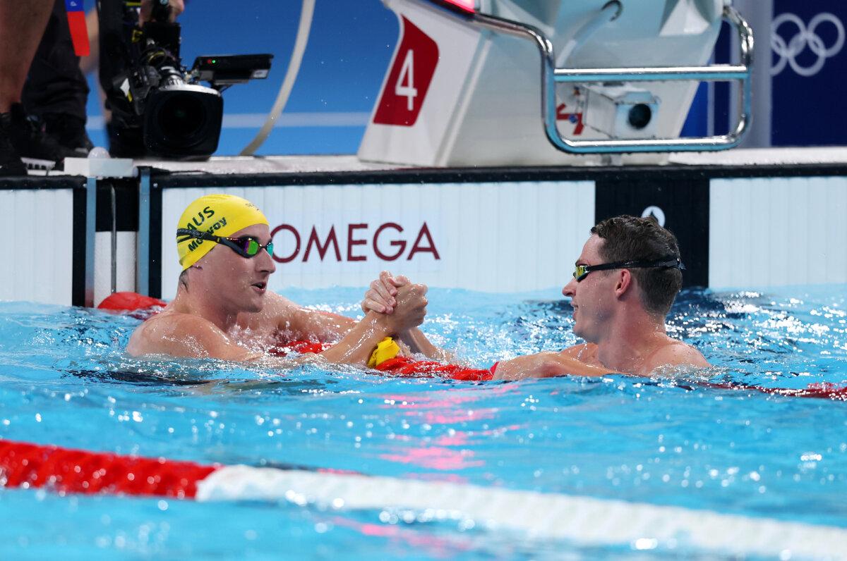 Cameron McEvoy of Team Australia and Benjamin Proud of Team Great Britain shake hands after winning gold and silver in the Men's 50m Freestyle Final on day seven of the Olympic Games Paris 2024 at Paris La Defense Arena in Nanterre, France on August 2, 2024. (Maddie Meyer/Getty Images)