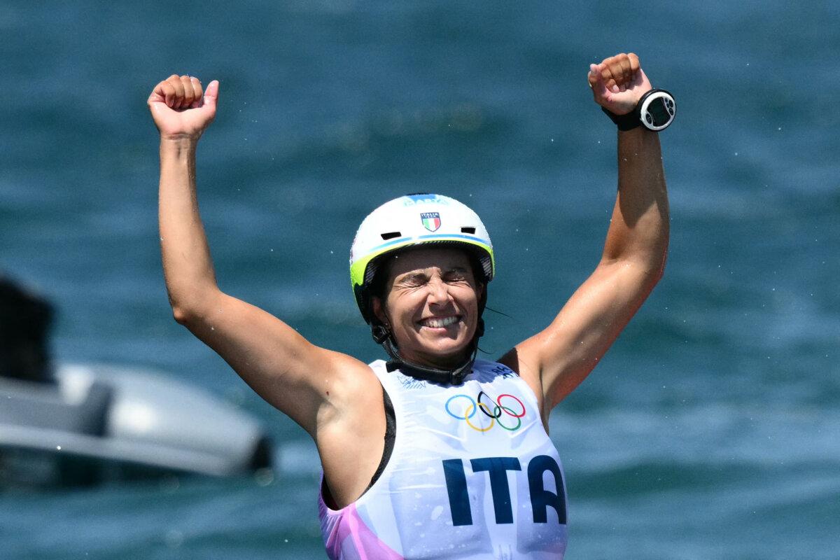 Gold medallist Italy's Marta Maggetti celebrates after winning the women's IQFoil windsurfing final during the Paris 2024 Olympic Games sailing competition at the Roucas-Blanc Marina in Marseille on August 3, 2024. (Christophe Simon/ AFP via Getty Images)