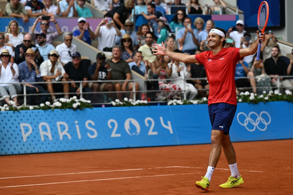 US' Taylor Fritz celebrates after he and US' Tommy Paul beat Czech Republic's Tomas Machac and Czech Republic's Adam Pavlasek in their men's doubles bronze medal tennis match on Court Philippe-Chatrier at the Roland-Garros Stadium during the Paris 2024 Olympic Games, in Paris on August 3, 2024. (Miguel Medina via Getty Images)