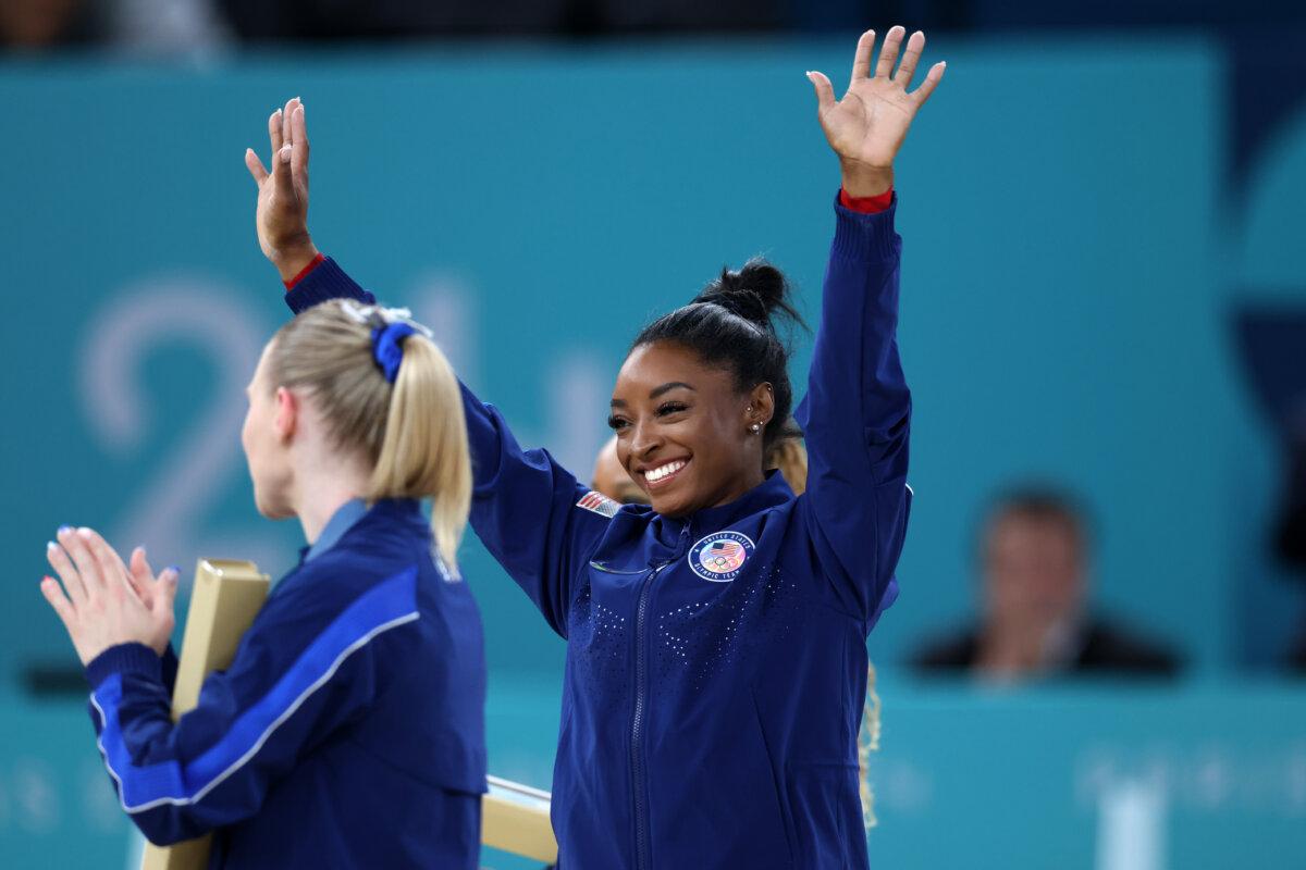 Gold medalist Simone Biles of Team United States celebrates on the podium during the medal ceremony for the Artistic Gymnastics Women's Vault Final on day eight of the Olympic Games Paris 2024 at Bercy Arena in Paris on August 3, 2024. (Pascal Le Segretain/Getty Images)
