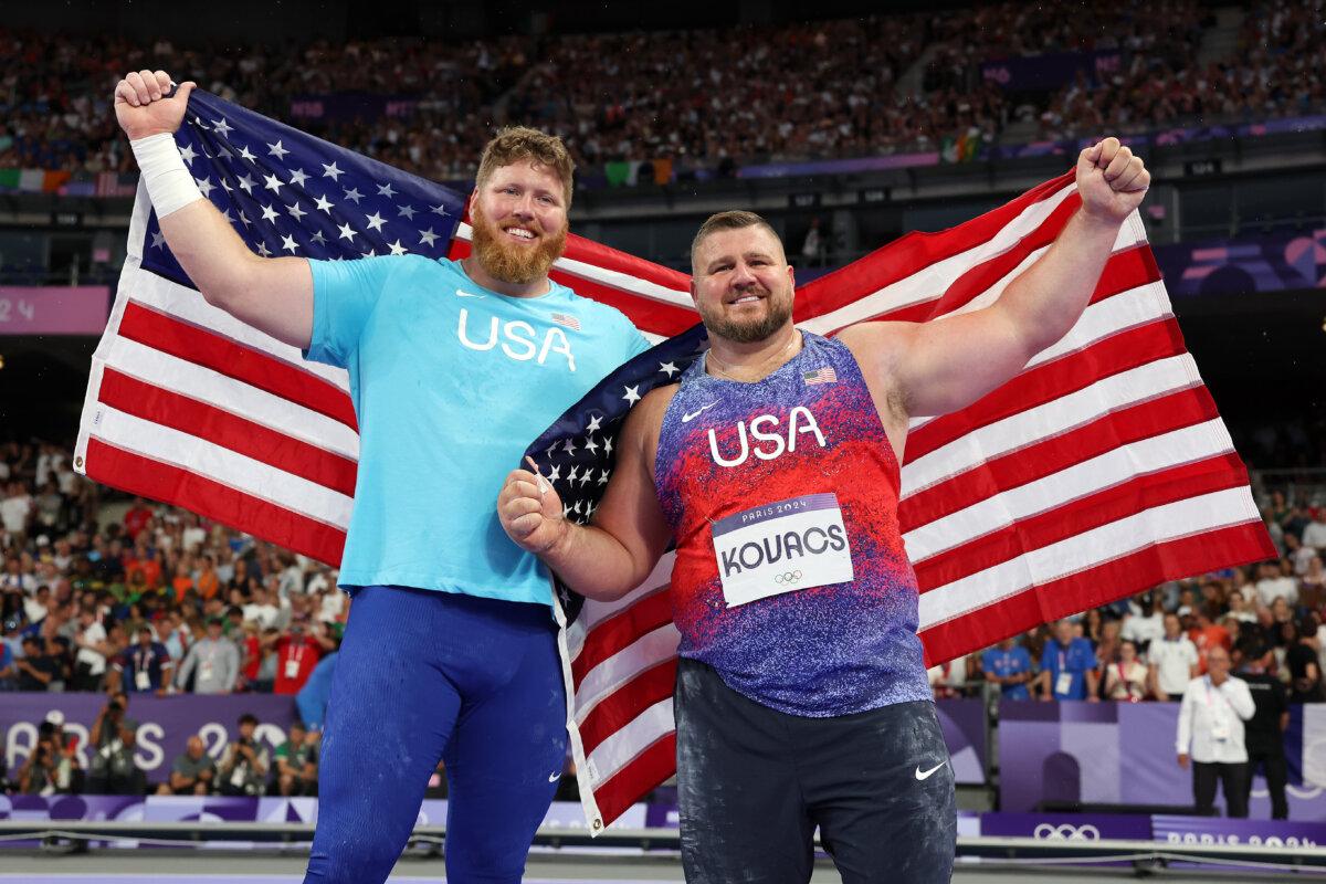 Gold medalist Ryan Crouser and silver medalist Joe Kovacs of Team United States celebrate following the Men's Shot Put Final on day eight of the Olympic Games Paris 2024 at Stade de France in Paris on August 3, 2024. (Michael Steele/Getty Images)