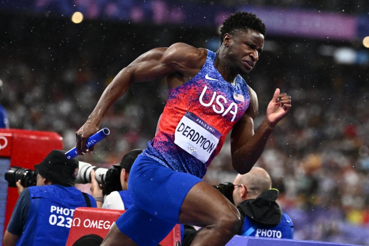US' Bryce Deadmon competes in the mixed 4x400m relay final of the athletics event at the Paris 2024 Olympic Games at Stade de France in Saint-Denis, north of Paris, on August 3, 2024. ( Jewel Samad / AFP via Getty Images)