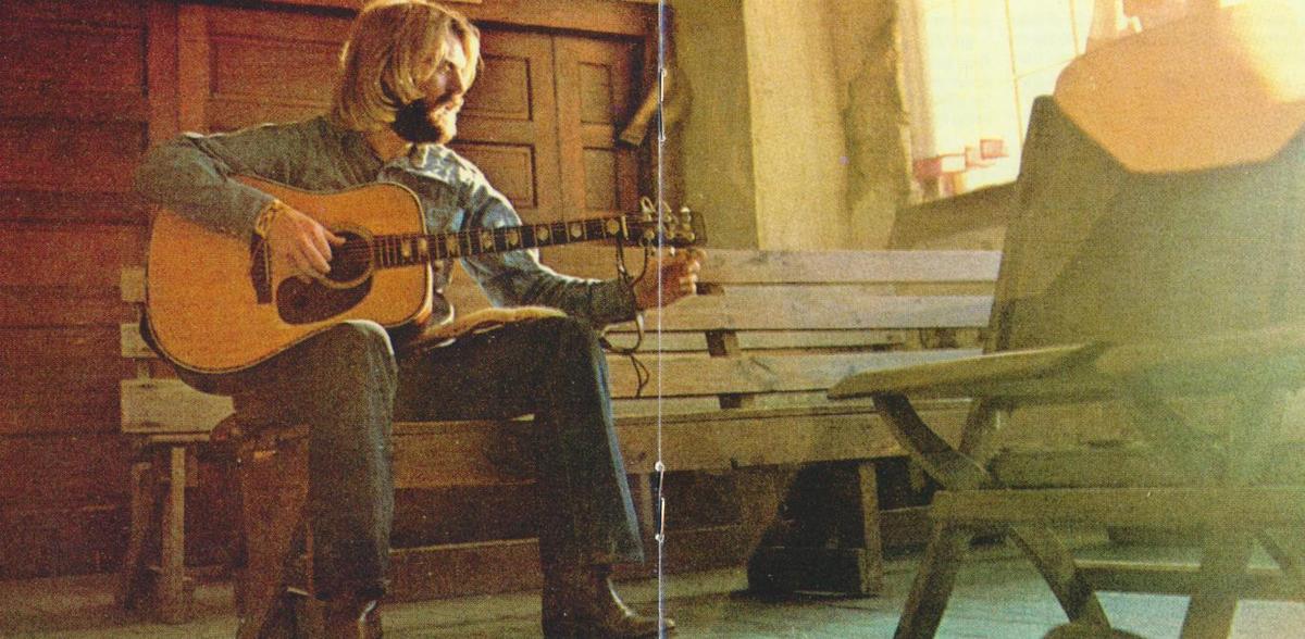 A portrait of Michael Martin Murphey in the CD pamphlet of the 1998 publication "Wildfire 1972–1984: The Original Cosmic Cowboy." Internet Archive. (Public Domain)