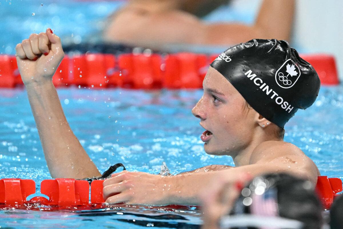 Canada's Summer Mcintosh celebrates after winning the final of the women's 200m individual medley swimming event during the Paris 2024 Olympic Games at the Paris La Defense Arena in Nanterre, west of Paris, on August 3, 2024. (Jonathan Nackstrand/ AFP via Getty Images)