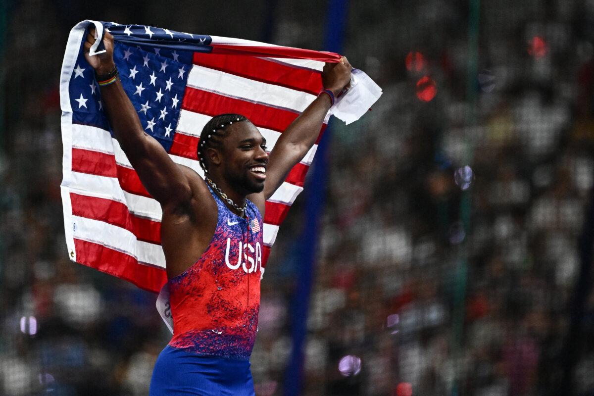 Noah Lyles of Team United States celebrates after winning the men's 100-meter final of the athletics event at the Paris 2024 Olympic Games at Stade de France in Saint-Denis, north of Paris, on Aug. 4, 2024. (Jewel Samad/AFP via Getty Images)