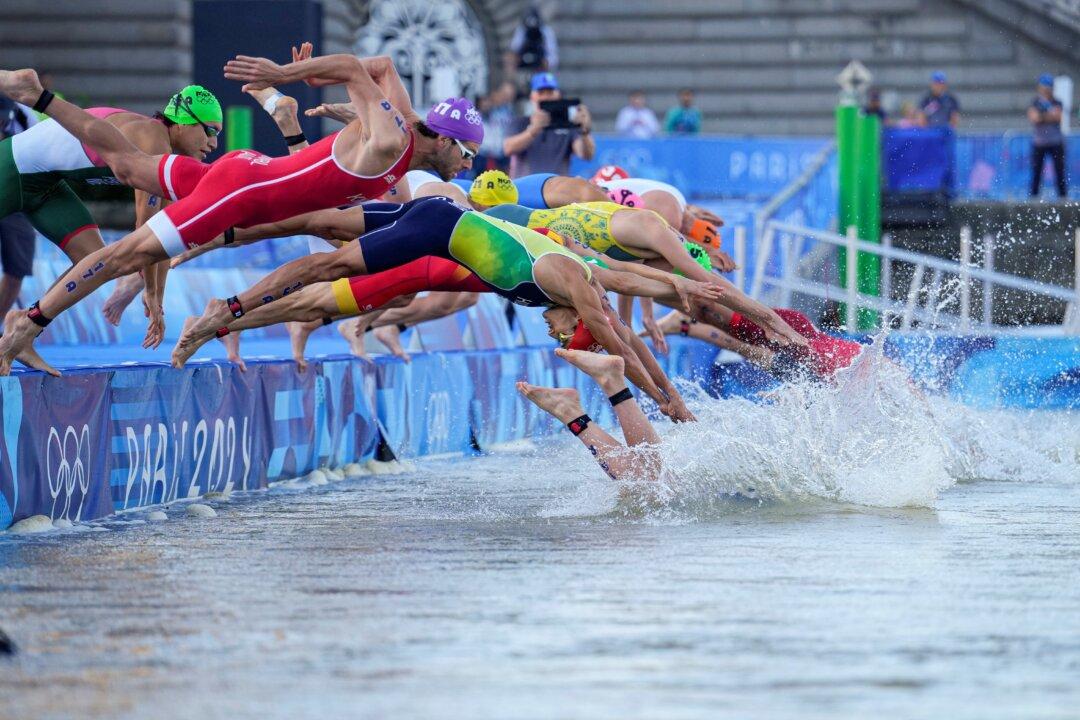 Olympic Triathlon Mixed Relay Goes Ahead With Swims in Seine Amid Water Quality Concerns
