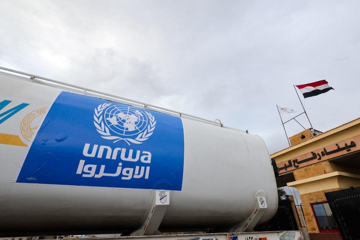 A truck, marked with the United Nations Relief and Works Agency (UNRWA) logo, crosses into Egypt from Gaza, at the Rafah border crossing between Egypt and the Gaza Strip, during a temporary truce between Hamas and Israel, in Rafah, Egypt, on Nov. 27, 2023. (Amr Abdallah Dalsh/Reuters)