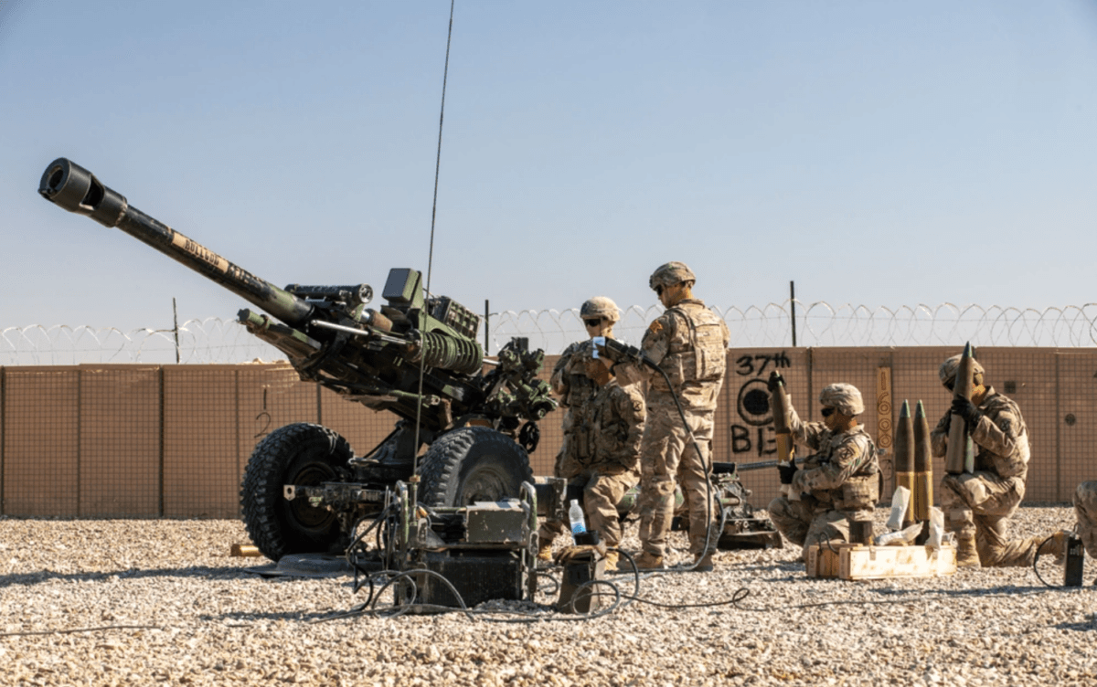 U.S. soldiers with 2nd Platoon, Bravo Battery, 2-15 Field Artillery, 2nd Brigade Combat Team, 10th Mountain Division conduct an artillery live fire exercise at Al Asad Air Base, Iraq, Dec. 1, 2023. (U.S. Army photo by Staff Sgt. Quince Lanford/Public Domain)