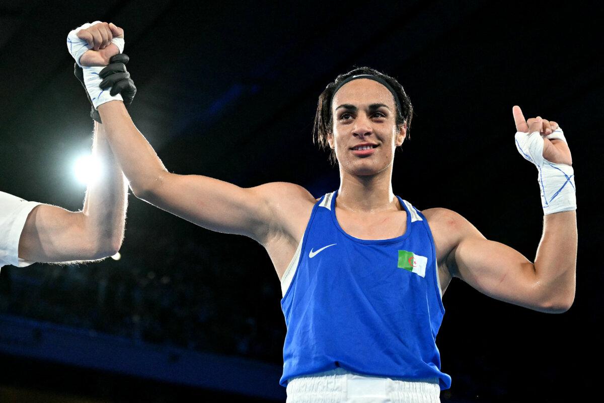 Algeria's Imane Khelif reacts after beating Thailand's Janjaem Suwannapheng in the women's 66-kilo semifinal boxing match during the Paris Olympic Games at the Roland-Garros Stadium, in Paris on Aug. 6, 2024. (Mohd Rasfan/AFP via Getty Images)