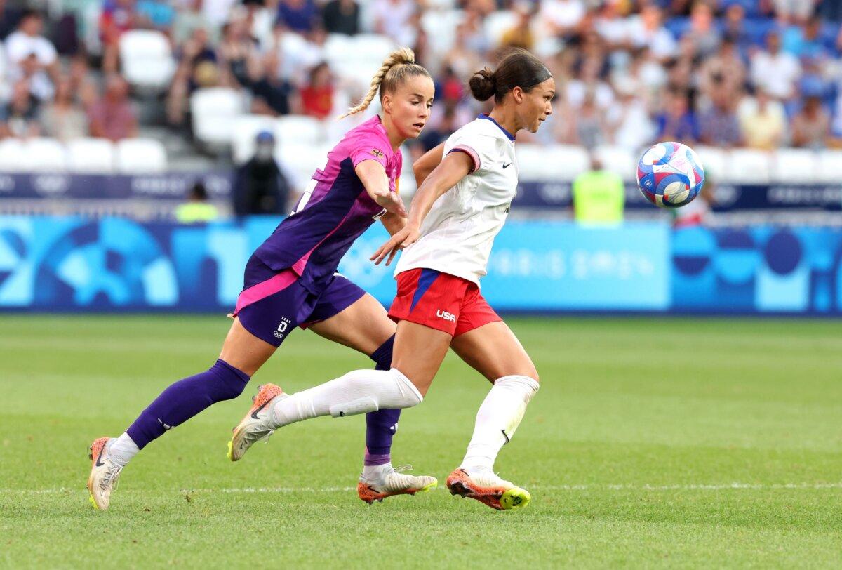 Sophia Smith (11) of Team United States advances the ball against Giulia Gwinn (15) of Team Germany during the Women's semifinal match between Team United States of America and Team Germany during the Olympic Games Paris 2024 in Lyon, France, on Aug. 6, 2024. (Claudio Villa/Getty Images)