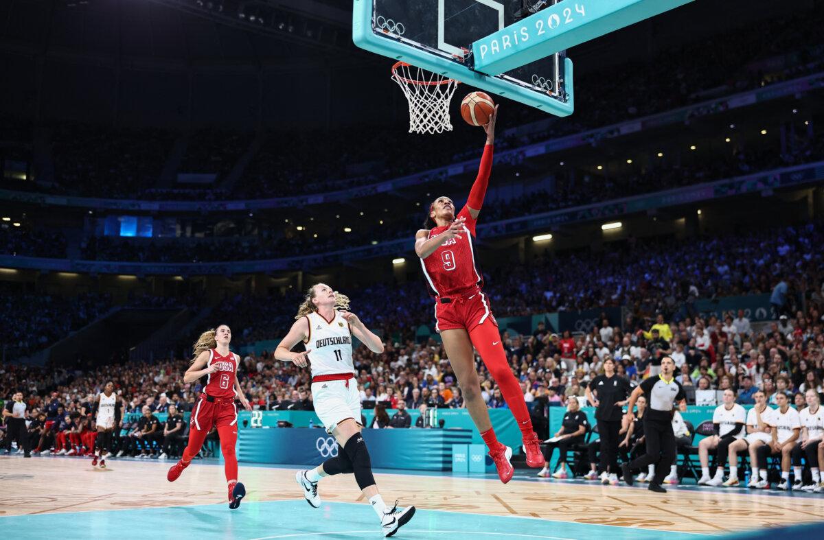 Team USA's A'ja Wilson goes to the basket and scores in the women's preliminary round group C basketball match between Germany and USA during the Paris 2024 Olympic Games at the Pierre-Mauroy stadium in Villeneuve-d'Ascq, northern France, on August 4, 2024. (Sameer Al-Doumy/AFP via Getty Images)