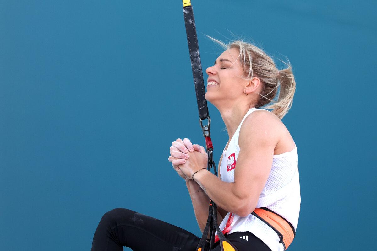 Aleksandra Miroslaw of Team Poland celebrates after their heat and setting a new world record during the women's speed climbing-seeding heats on day ten of the Olympic Games at Le Bourget Sport Climbing Venue in Paris on Aug. 5, 2024. (Michael Reaves/Getty Images)