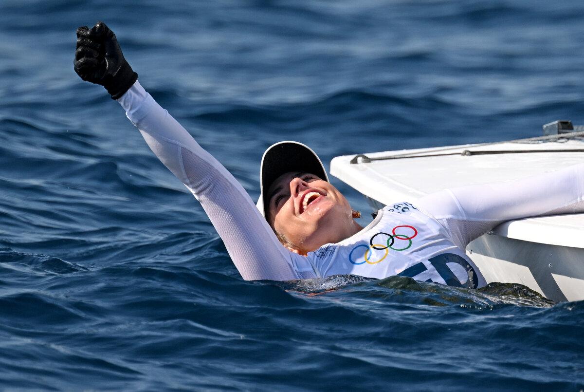 Marit Bouwmeester of Team Netherlands celebrates after securing the gold medal in the women's dinghy ILCA class on day ten of the Paris Olympic Games at Marseille Marina in Marseille, France, on Aug. 5, 2024. (Clive Mason/Getty Images)