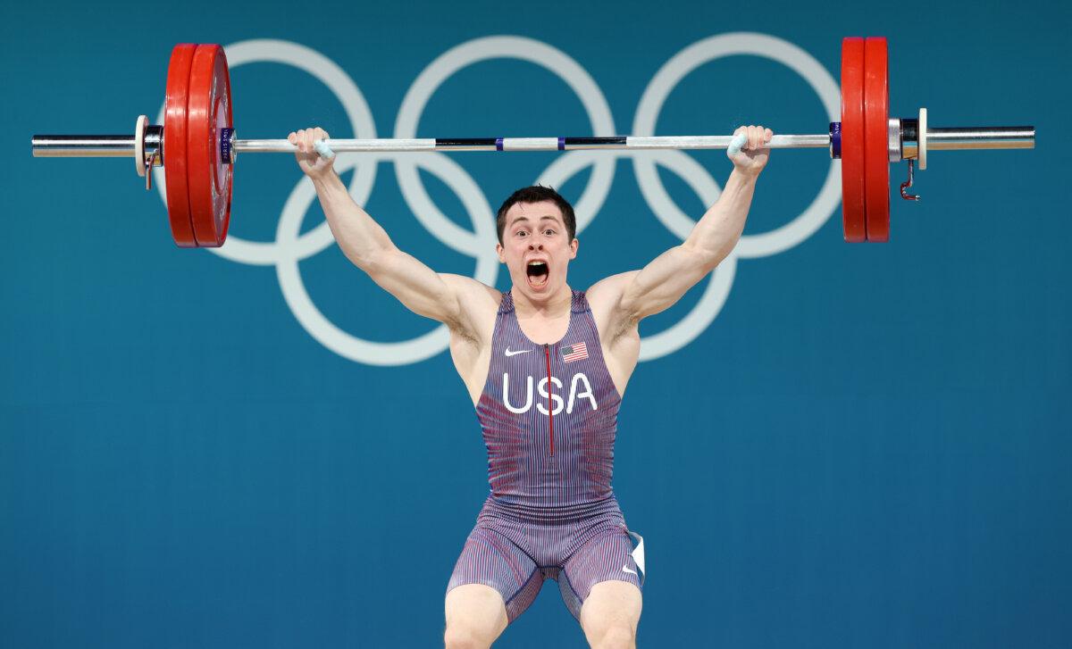 Hampton Morris of Team United States performs a clean and jerk during the Weightlifting Men's 61kg on day twelve of the Olympic Games in Paris on Aug. 7, 2024. (Lars Baron/Getty Images)