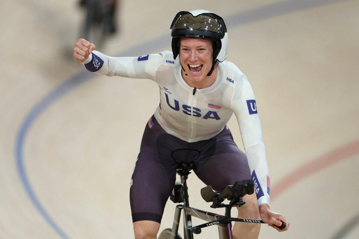 Team USA's Lily Williams celebrates her team's victory after winning the women's track cycling team pursuit final for gold of the Olympic Games at the Saint-Quentin-en-Yvelines National Velodrome in Montigny-le-Bretonneux in Paris on Aug. 7, 2024. (Thomas Samson/ AFP via Getty Images)