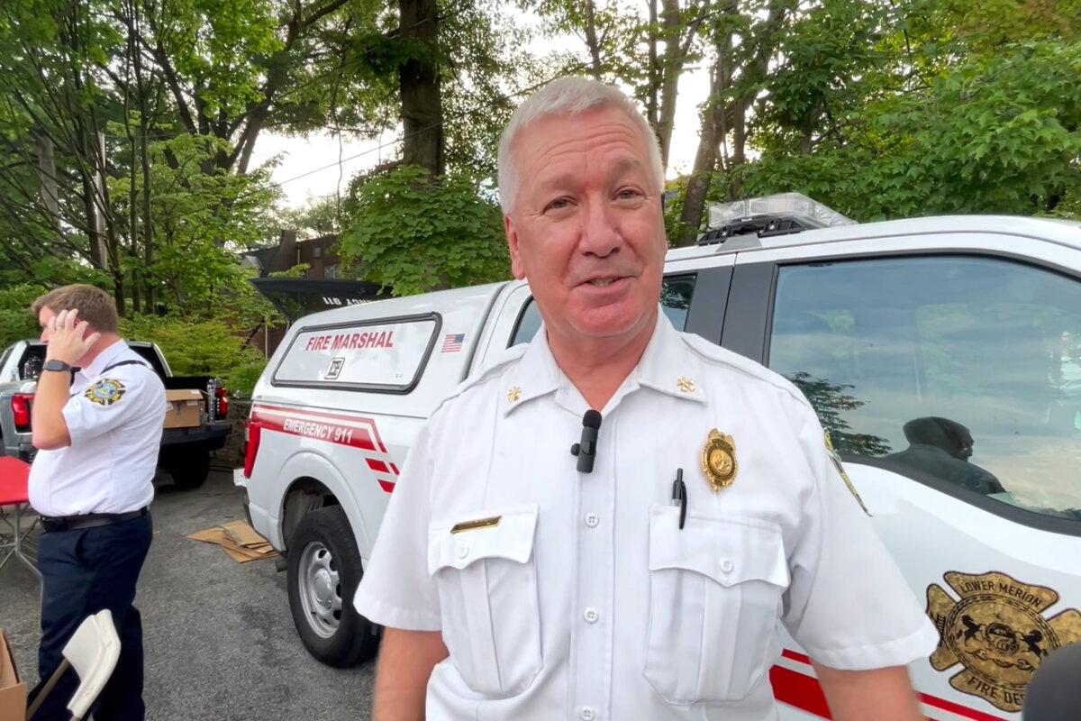 Matt McGuire, Deputy Fire Marshal for Lower Merion Township, attends the annual National Night Out festival in Wynnewood, Pa., on the evening of Aug. 6, 2024. (Frank Liang/The Epoch Times)