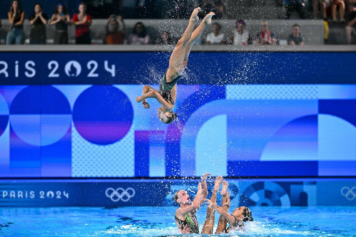 Team USA compete in the team acrobatic routine of the artistic swimming event during the Olympic Games at the Aquatics Centre in Saint-Denis in Paris on Aug. 7, 2024. (Manan Vatsyayana/AFP via Getty Images)