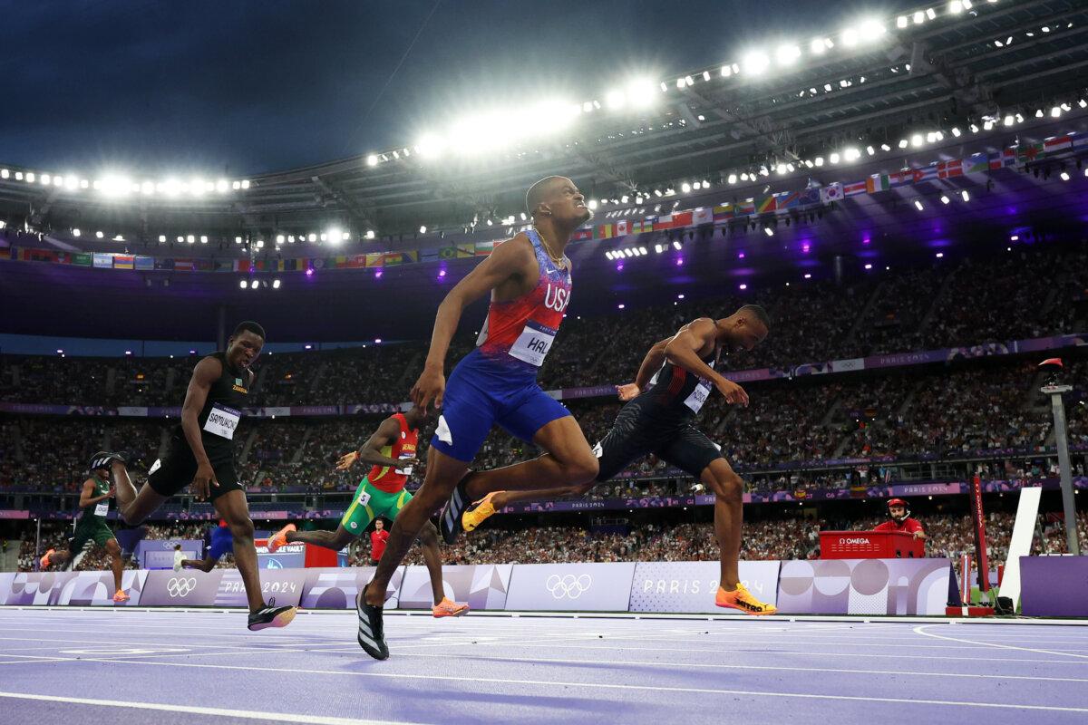 Quincy Hall of Team United States crosses the finish line during the men's 400-meter final on day twelve of the Olympic Games Paris 2024 at Stade de France in Paris on Aug. 7, 2024. (Christian Petersen/Getty Images)