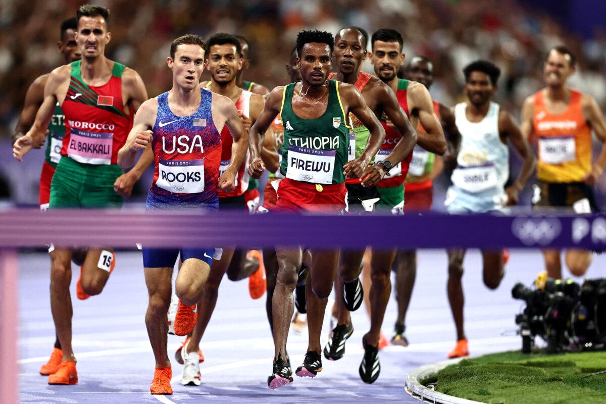 Team USA's Kenneth Rooks (2nd-L) and other athletes compete in the men's 3000m steeplechase final of the athletics event at the Olympic Games at Stade de France in Saint-Denis in Paris on Aug. 7, 2024. (Anne-Christine Poujoulat/AFP via Getty Images)