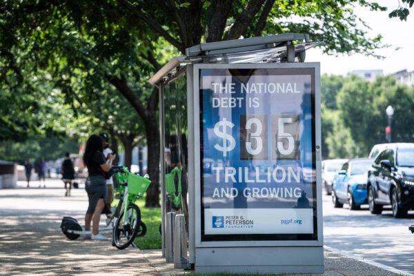 The national debt clock at a bus station in Washington, on Aug. 6, 2024. (Madalina Vasiliu/The Epoch Times)