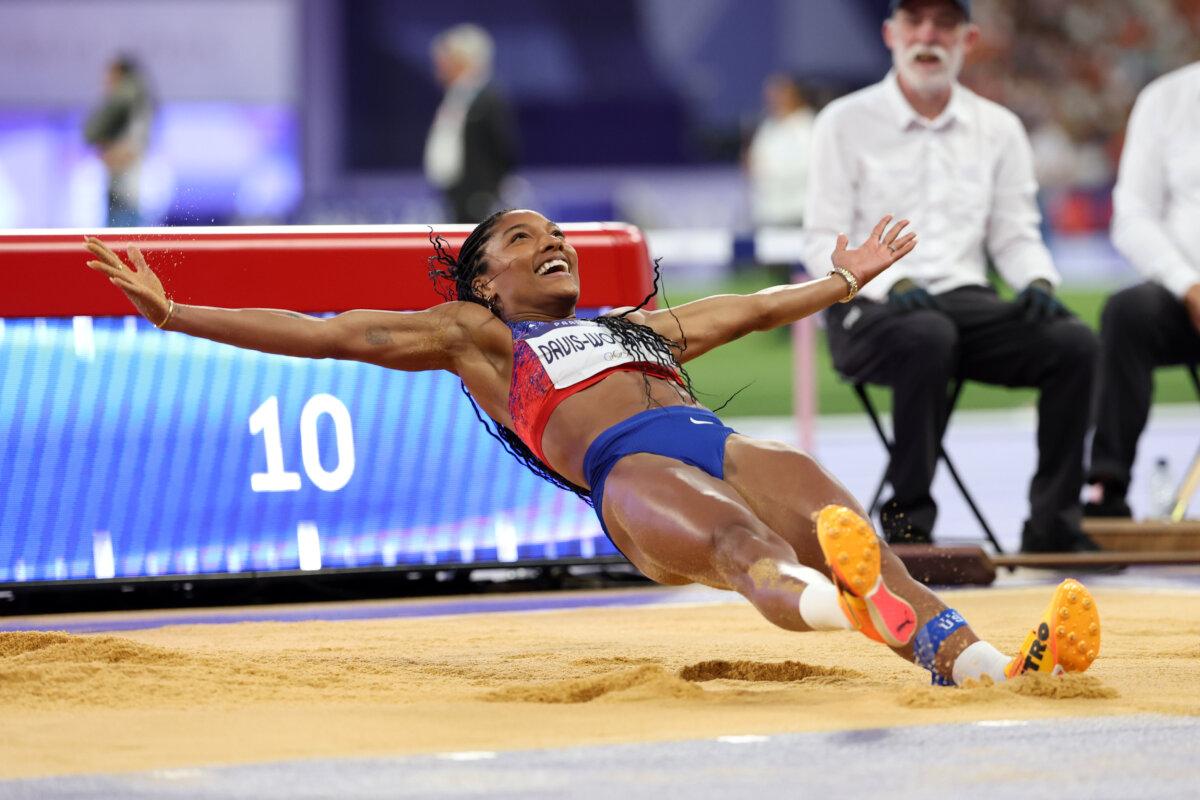 Tara Davis-Woodhall of Team United States celebrates winning the gold medal after competing in the women's long jump final on day 13 of the Olympic Games at Stade de France in Paris on Aug. 8, 2024. (Patrick Smith/Getty Images)
