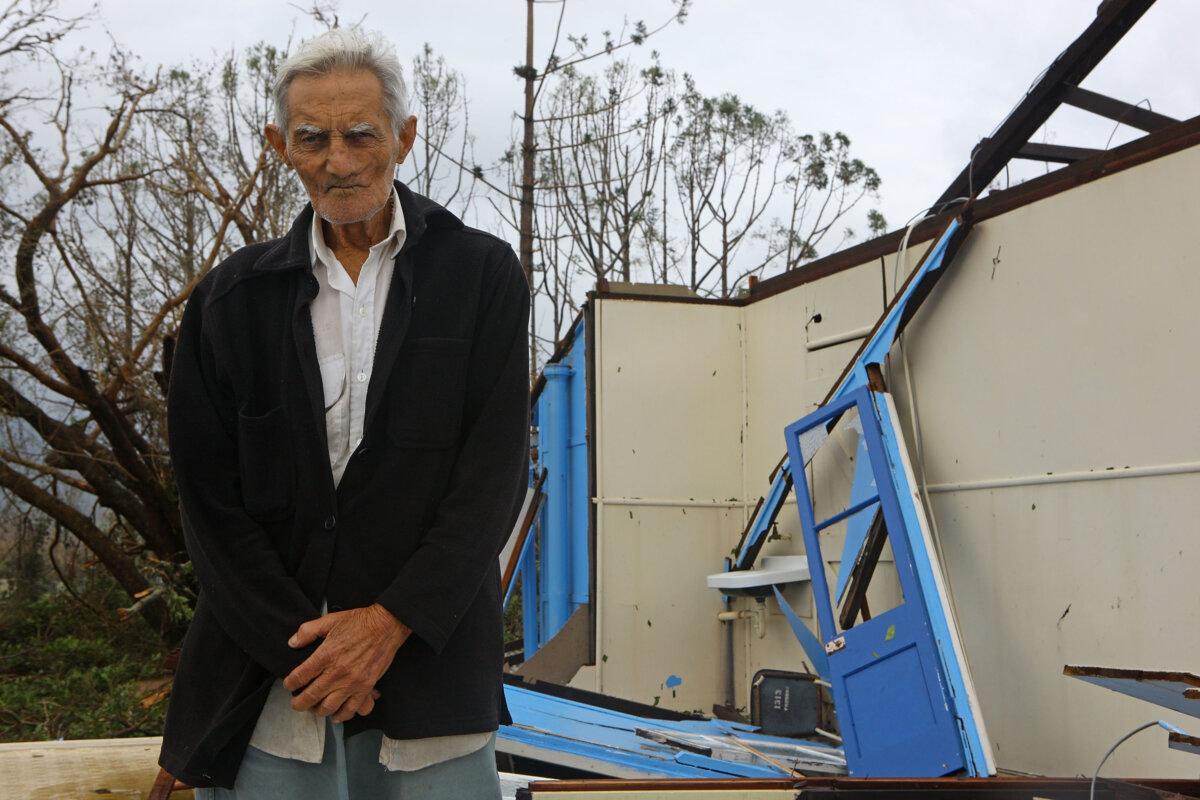 Theo, a resident of Cardwell in his home damaged during cyclone Yasi, in Cardwell Australia on Feb. 4, 2011. (Jonathan Wood/Getty Images)