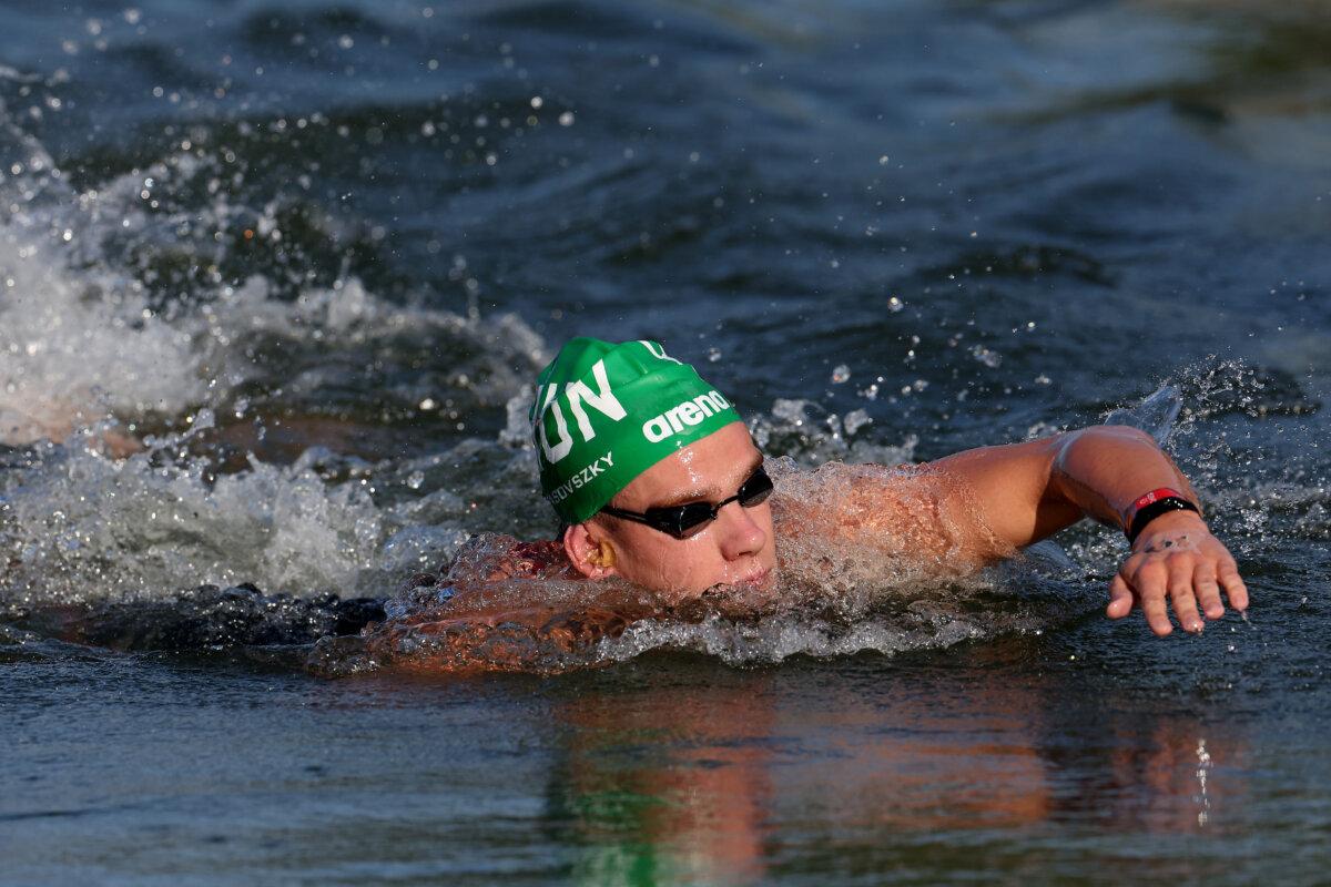 Kristof Rasovszky of Team Hungary competes in the marathon swimming men's 10K on day 14 of the Olympic Games at Pont Alexandre III in Paris on Aug. 9, 2024. (Luke Hales/Getty Images)