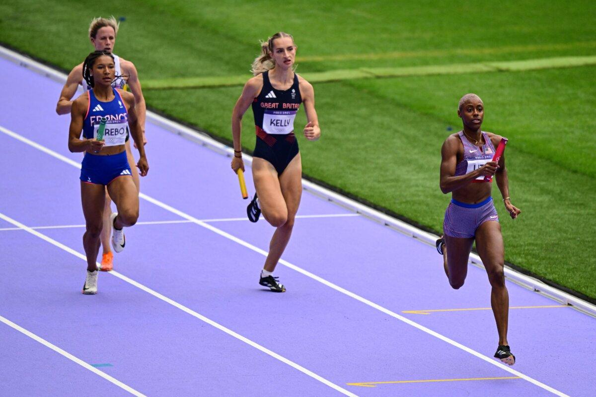 Team USA's Shamier Little leads ahead of Britain's Hannah Kelly in the women's 4x400-meter relay heat of the athletics event at the Paris 2024 Olympic Games at Stade de France in Saint-Denis, north of Paris, on Aug. 9, 2024. (Martin Bernetti/AFP via Getty Images)