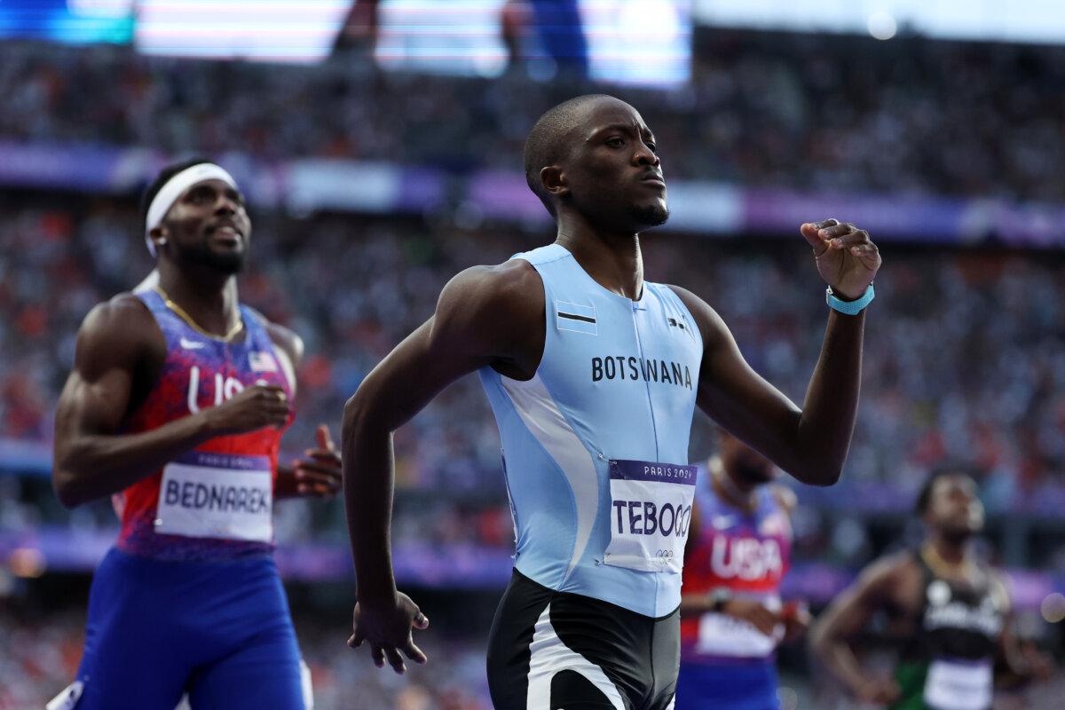 Letsile Tebogo of Team Botswana celebrates winning the gold medal after competing in the men's 200-meter final on day 13 of the Olympic Games at Stade de France in Paris on Aug. 8, 2024. (Hannah Peters/Getty Images)