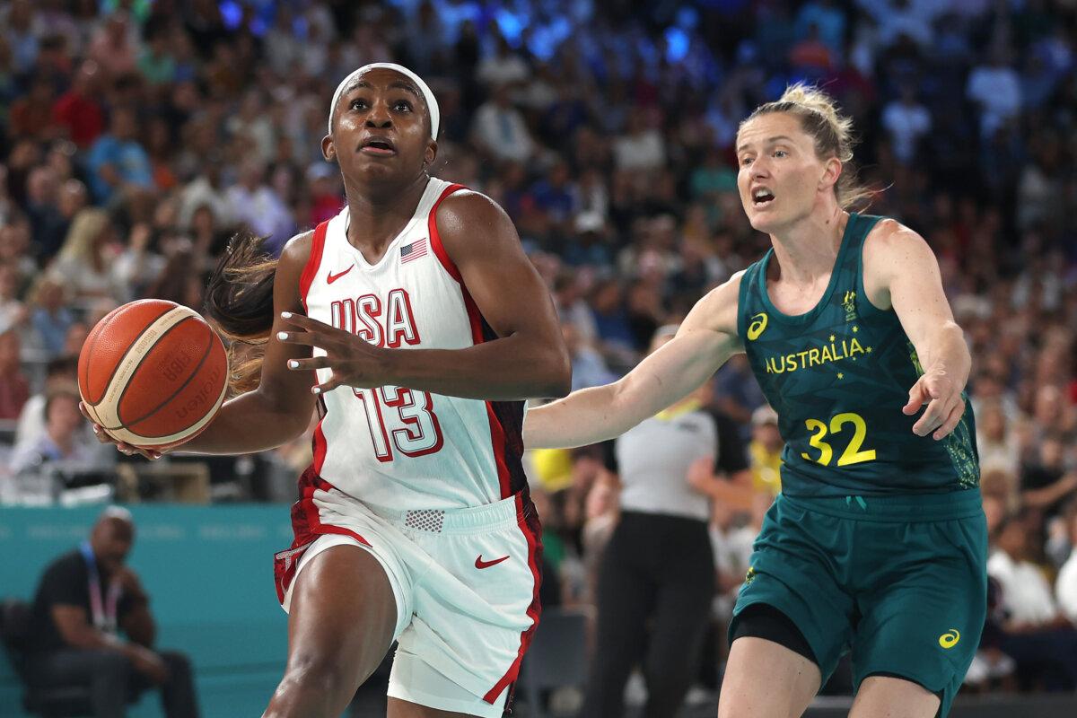Jackie Young of Team United States drives past Sami Whitcomb of Team Australia during a women's semifinal match between Team United States and Team Australia on day 14 of the Olympic Games at Bercy Arena in Paris on Aug. 9, 2024. (Sarah Stier/Getty Images)