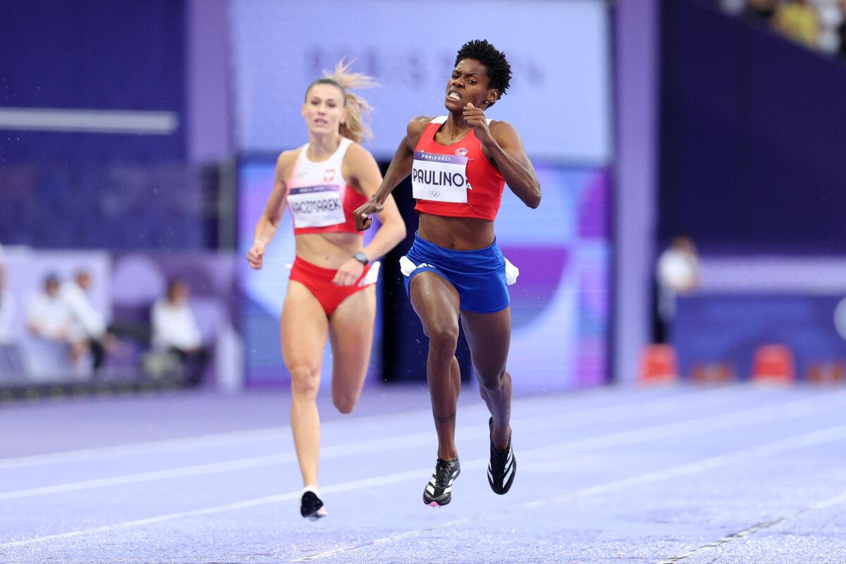 Marileidy Paulino of Team Dominican Republic crosses the finish line to win after competing in the women's 400-meter final on day 14 of the Olympic Games at Stade de France in Paris on Aug. 9, 2024. (Hannah Peters/Getty Images)