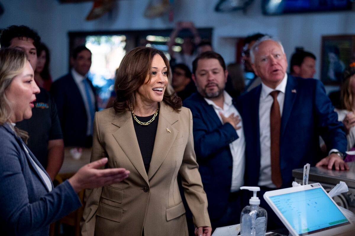 Lake, Gallego Vie to Represent Arizona in Senate 3 Vice President Kamala Harris, Rep. Ruben Gallego (D-Ariz.) (2nd-R), and Democratic vice presidential candidate Minnesota Gov. Tim Walz (R) order food at Cocina Adamex restaurant in Phoenix, Ariz., on Aug. 9, 2024. (Andrew Harnik/Getty Images)