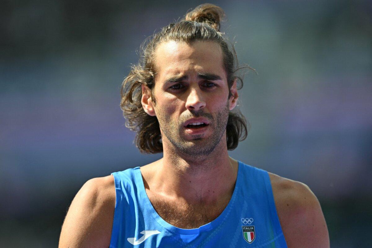 Italy's Gianmarco Tamberi reacts in the men's high jump qualification of the athletics event at the Paris 2024 Olympic Games at Stade de France in Saint-Denis, north of Paris, on August 7, 2024. (Photo by Andrej ISAKOVIC / AFP) (Photo by ANDREJ ISAKOVIC/AFP via Getty Images)